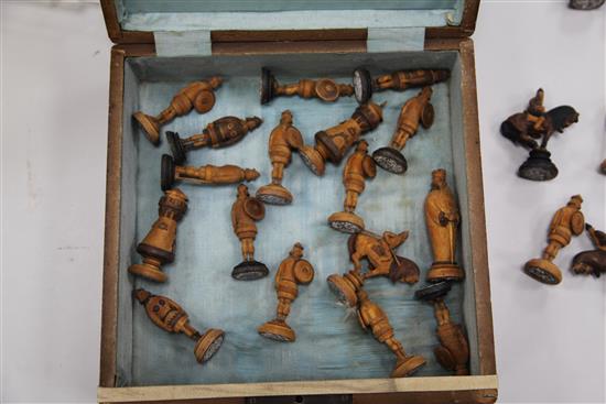 An unusual 19th century Russian figural carved wood chess set,